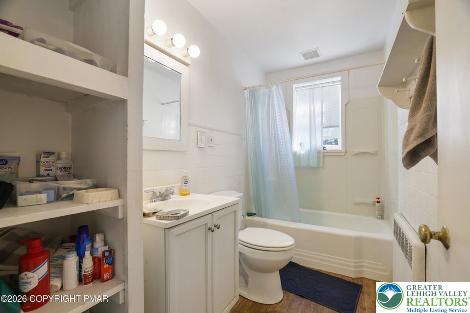 1207 Seese Hill Road Canadensis, PA 18325 - Photo 16 of 49 A classic tub shower combination sits beneath a window in this functional space.