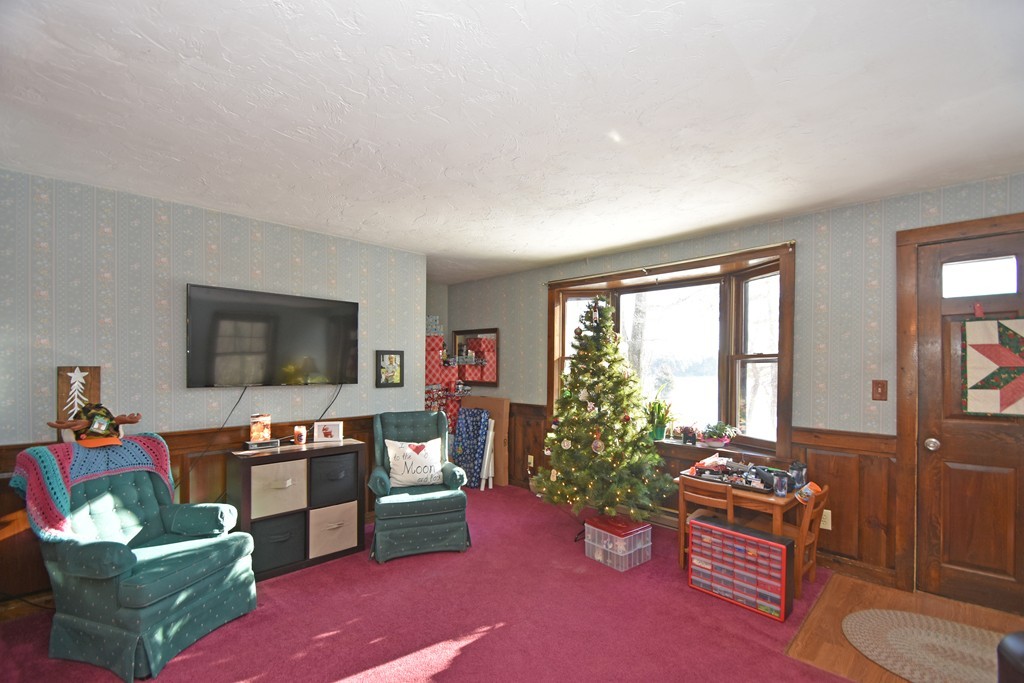 46 Davis Road, Unit B Millbury, MA 01527 - Photo 2 of 18 a living room with furniture and a flat screen tv