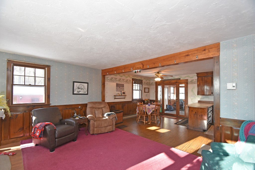 46 Davis Road, Unit B Millbury, MA 01527 - Photo 3 of 18 a living room with furniture a couch and large window