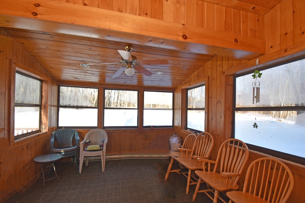 46 Davis Road, Unit B Millbury, MA 01527 - Photo 7 of 18 a view of a room with furniture windows and wooden walls