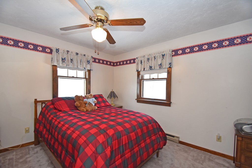 46 Davis Road, Unit B Millbury, MA 01527 - Photo 10 of 18 a bedroom with a bed and window