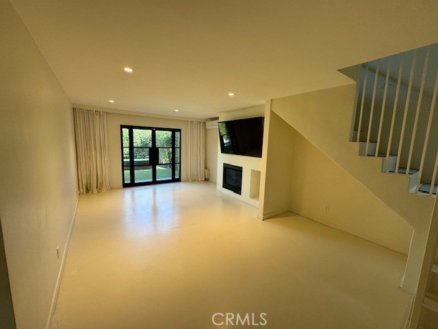 335 Flint Avenue Long Beach, CA 90814 - Photo 13 of 46 a view of an empty room with a fireplace and a window