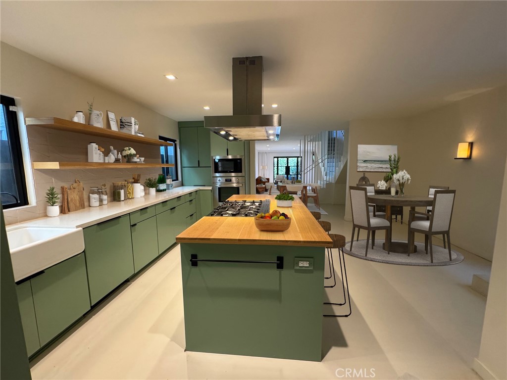 335 Flint Avenue Long Beach, CA 90814 - Photo 20 of 46 a kitchen with kitchen island stainless steel appliances a sink and counter top space