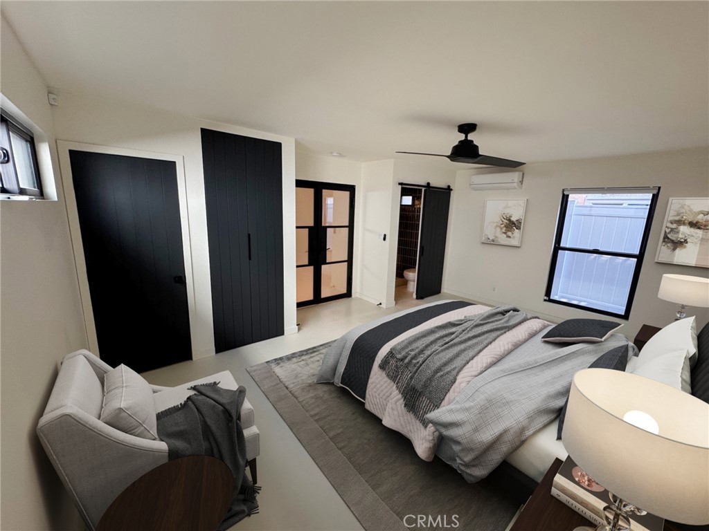 335 Flint Avenue Long Beach, CA 90814 - Photo 23 of 46 a bedroom with a bed and a mirror