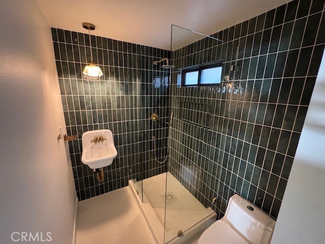 335 Flint Avenue Long Beach, CA 90814 - Photo 25 of 46 a bathroom with a sink toilet and shower
