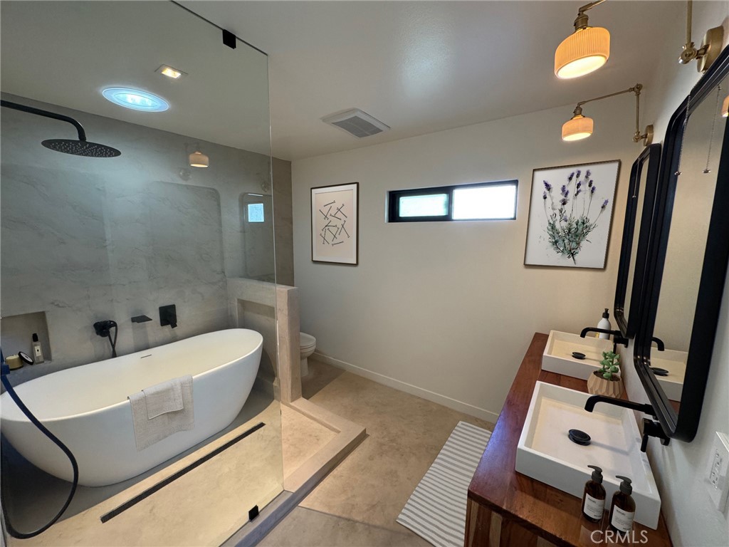 335 Flint Avenue Long Beach, CA 90814 - Photo 31 of 46 a bathroom with a sink mirror and toilet