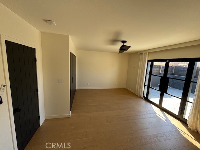 335 Flint Avenue Long Beach, CA 90814 - Photo 35 of 46 wooden floor in an empty room with a window