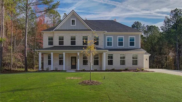front view of a house with a yard
