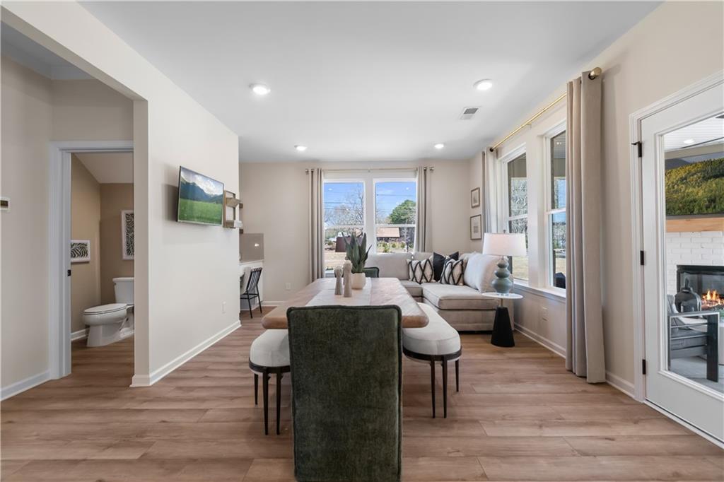 420 Hartsfield Road McDonough, GA 30252 - Photo 13 of 45 a living room with furniture and a wooden floor