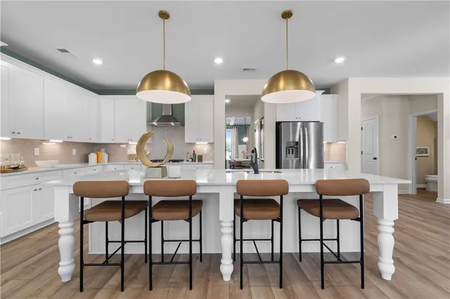 a dining room with furniture and wooden floor
