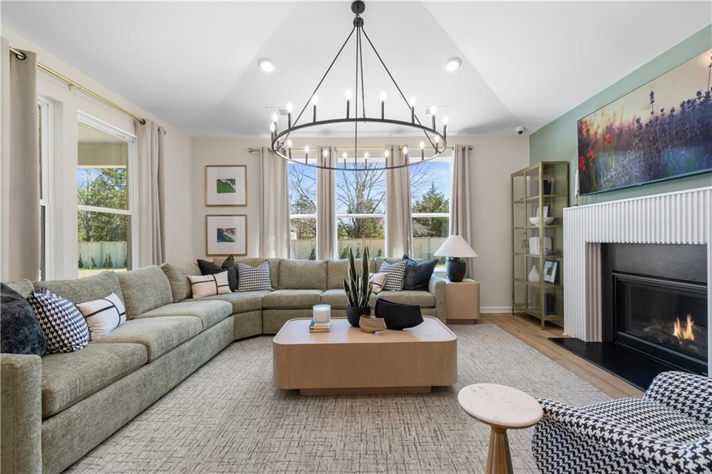 420 Hartsfield Road McDonough, GA 30252 - Photo 21 of 45 a living room with furniture fireplace and a large window