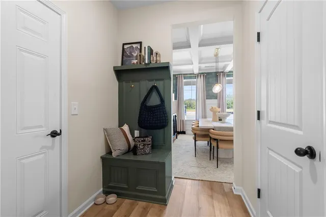 a living room with furniture a wooden floor and a fireplace