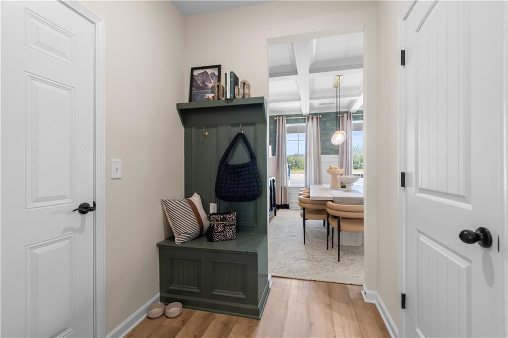 420 Hartsfield Road McDonough, GA 30252 - Photo 25 of 45 a living room with furniture a wooden floor and a fireplace