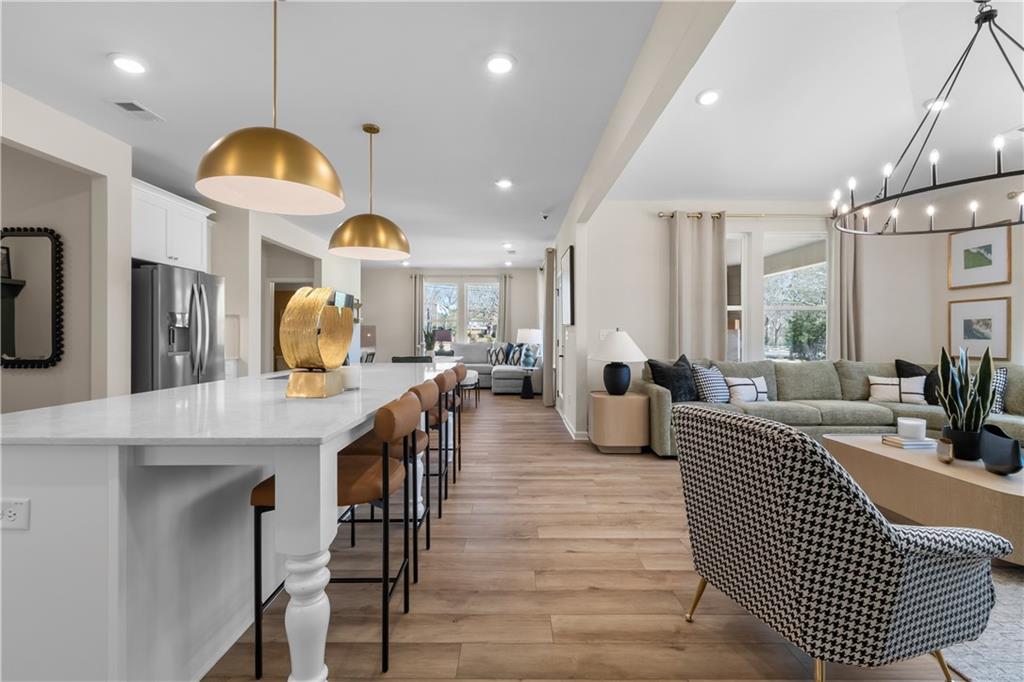 420 Hartsfield Road McDonough, GA 30252 - Photo 26 of 45 a living room with furniture a window and kitchen view
