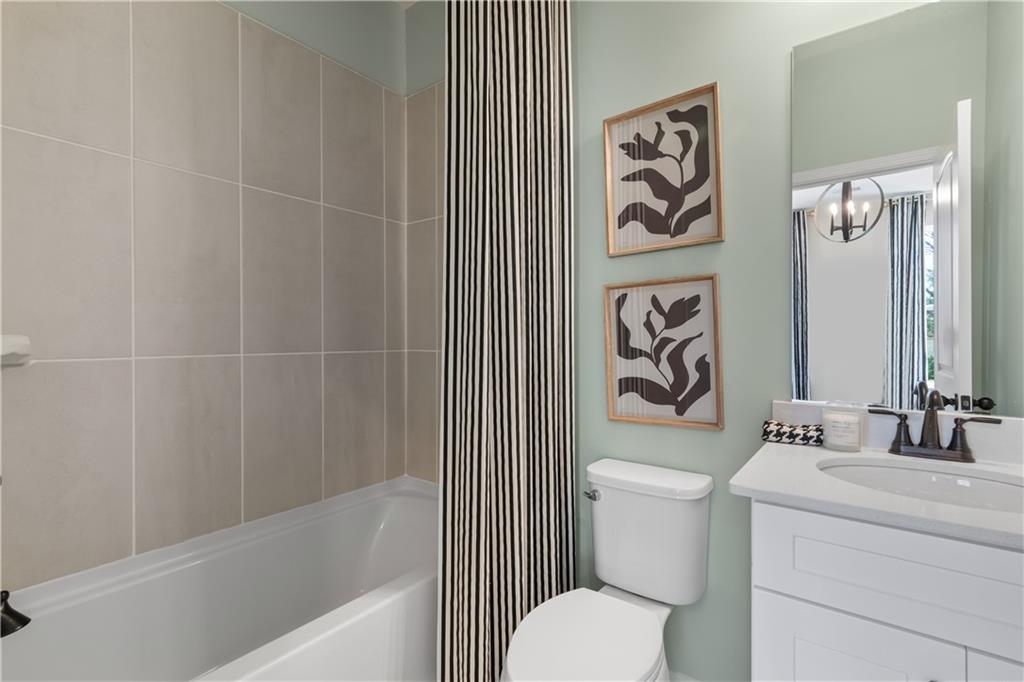 420 Hartsfield Road McDonough, GA 30252 - Photo 28 of 45 a bathroom with a sink a toilet and a bathtub