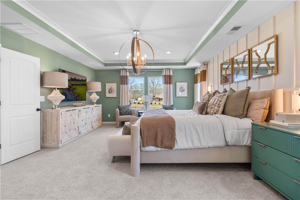 420 Hartsfield Road McDonough, GA 30252 - Photo 39 of 45 a spacious bedroom with a bed couch chandelier and a window