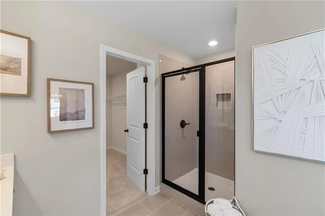 a bathroom with a shower and a mirror