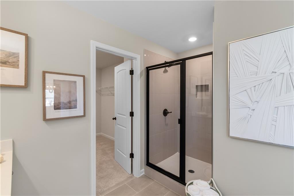 420 Hartsfield Road McDonough, GA 30252 - Photo 42 of 45 a bathroom with a shower and a mirror