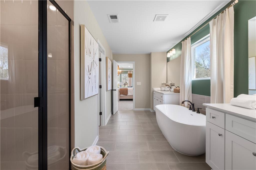 420 Hartsfield Road McDonough, GA 30252 - Photo 44 of 45 a bathroom with a bathtub and a sink