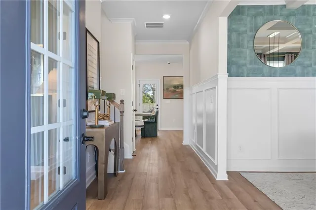 a view of a livingroom with furniture and hardwood floor