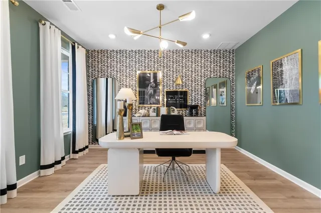 a large kitchen with a table and chairs