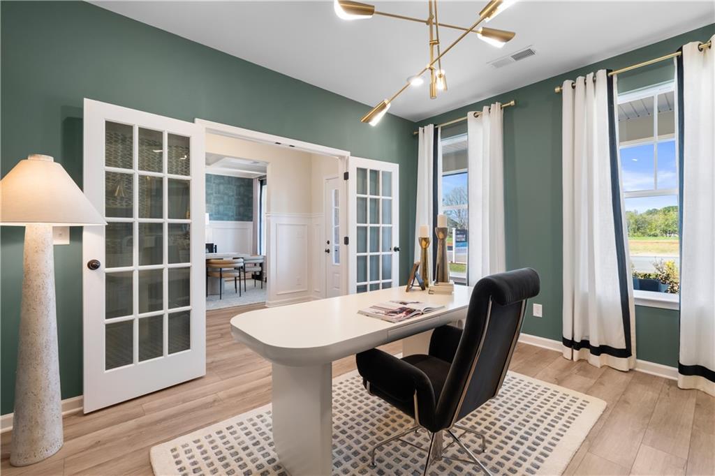 420 Hartsfield Road McDonough, GA 30252 - Photo 9 of 45 a view of a dining room with furniture window and wooden floor