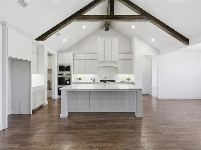 a view of kitchen with center island wooden floor and center island