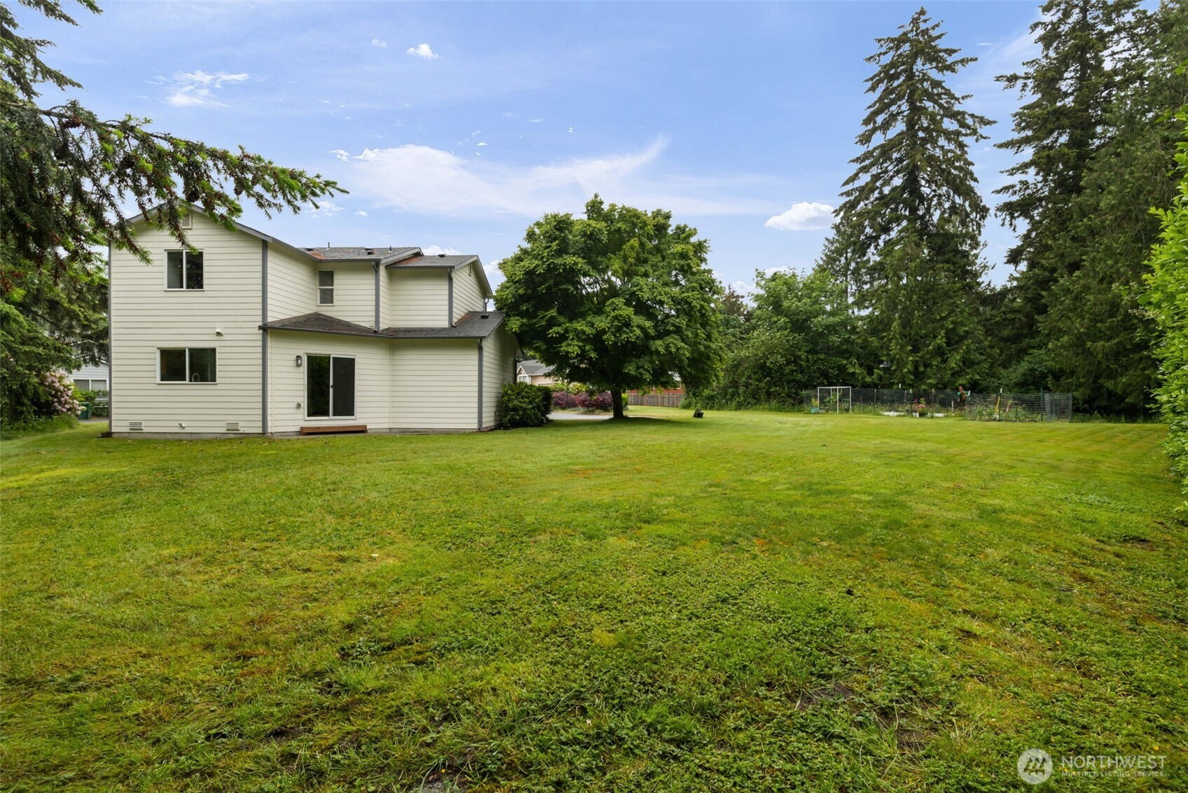 3560 Courtyard Lane Bremerton, WA 98310 - Photo 23 of 26 a view of a house with a big yard