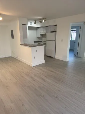 a view of a kitchen with a sink and dishwasher