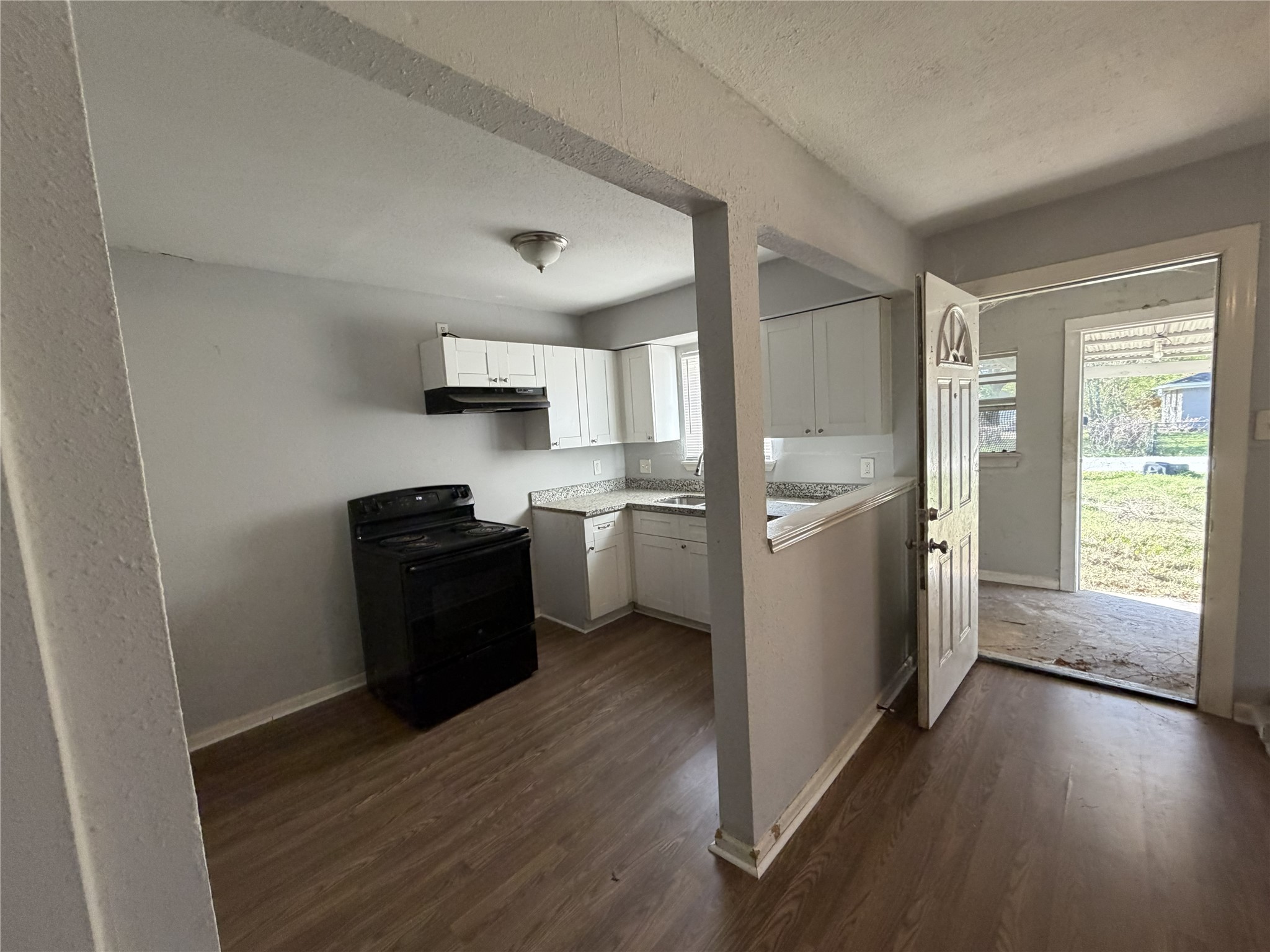 2409 Hodges Street Baytown, TX 77521 - Photo 1 of 29 a kitchen with a refrigerator and a stove top oven