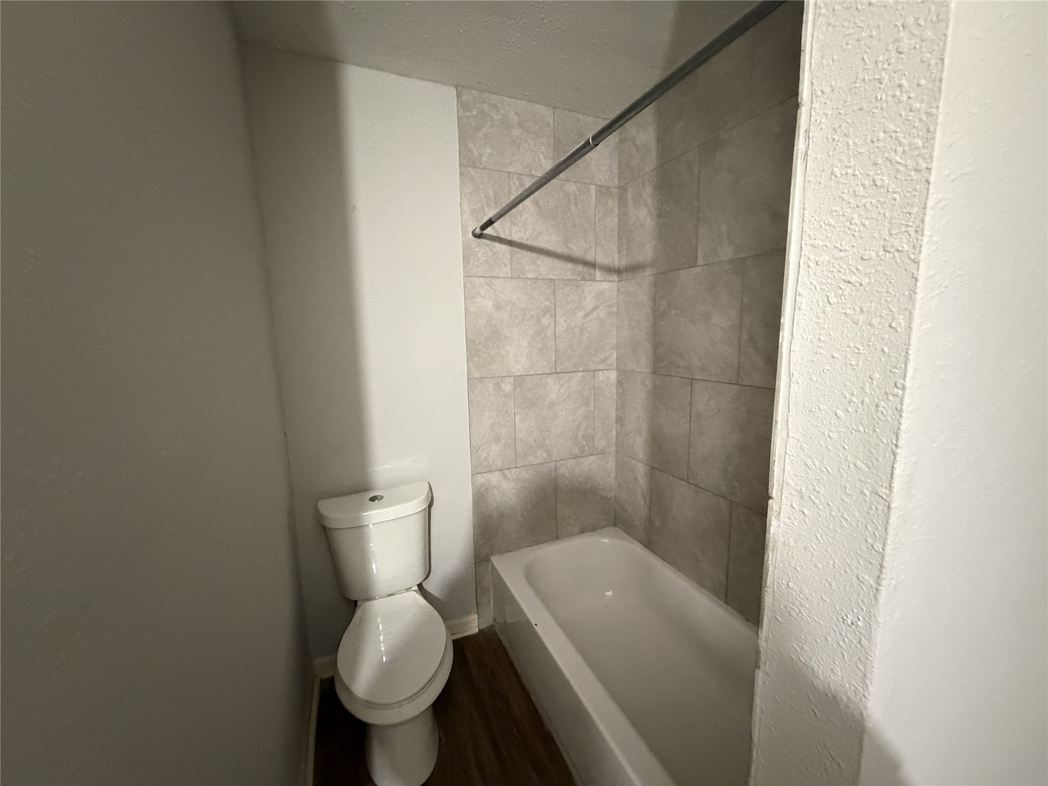 2409 Hodges Street Baytown, TX 77521 - Photo 11 of 29 a white toilet sitting next to a shower and a sink