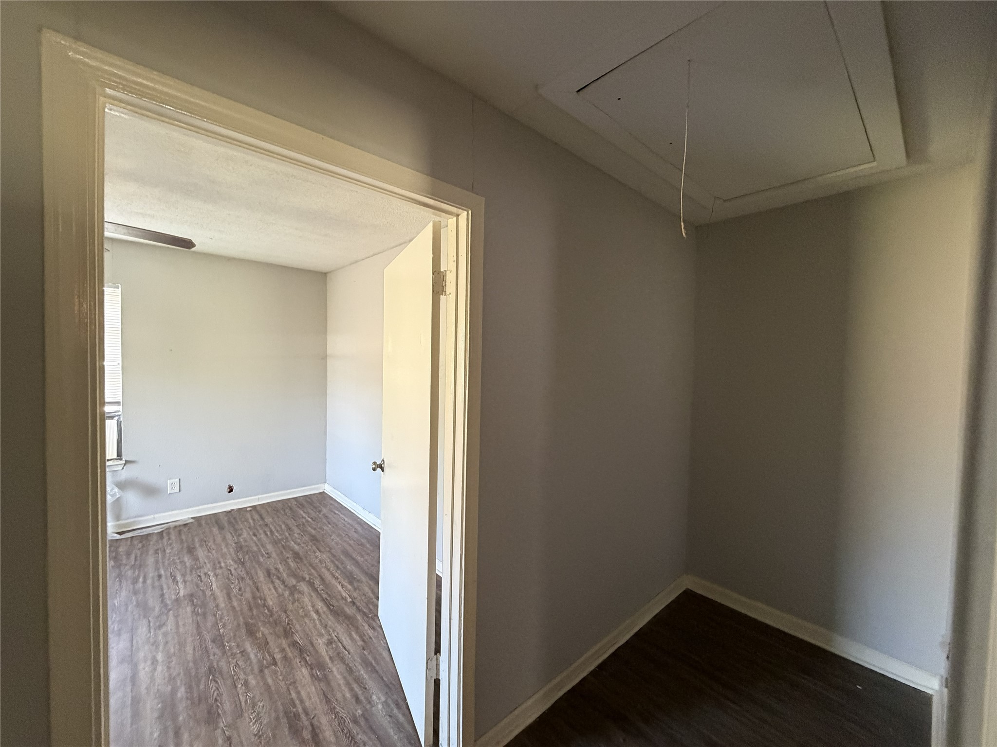 2409 Hodges Street Baytown, TX 77521 - Photo 12 of 29 an empty room with wooden floor and windows