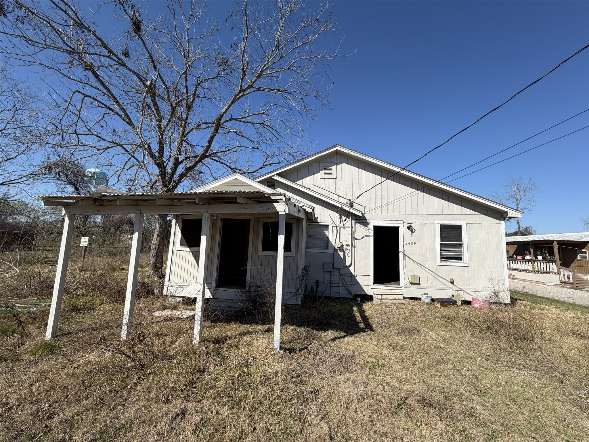 2409 Hodges Street Baytown, TX 77521 - Photo 13 of 29 a view of a house with a yard