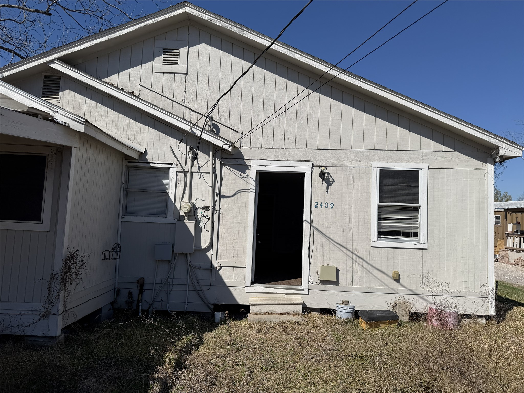 2409 Hodges Street Baytown, TX 77521 - Photo 14 of 29 a view of a house with a yard