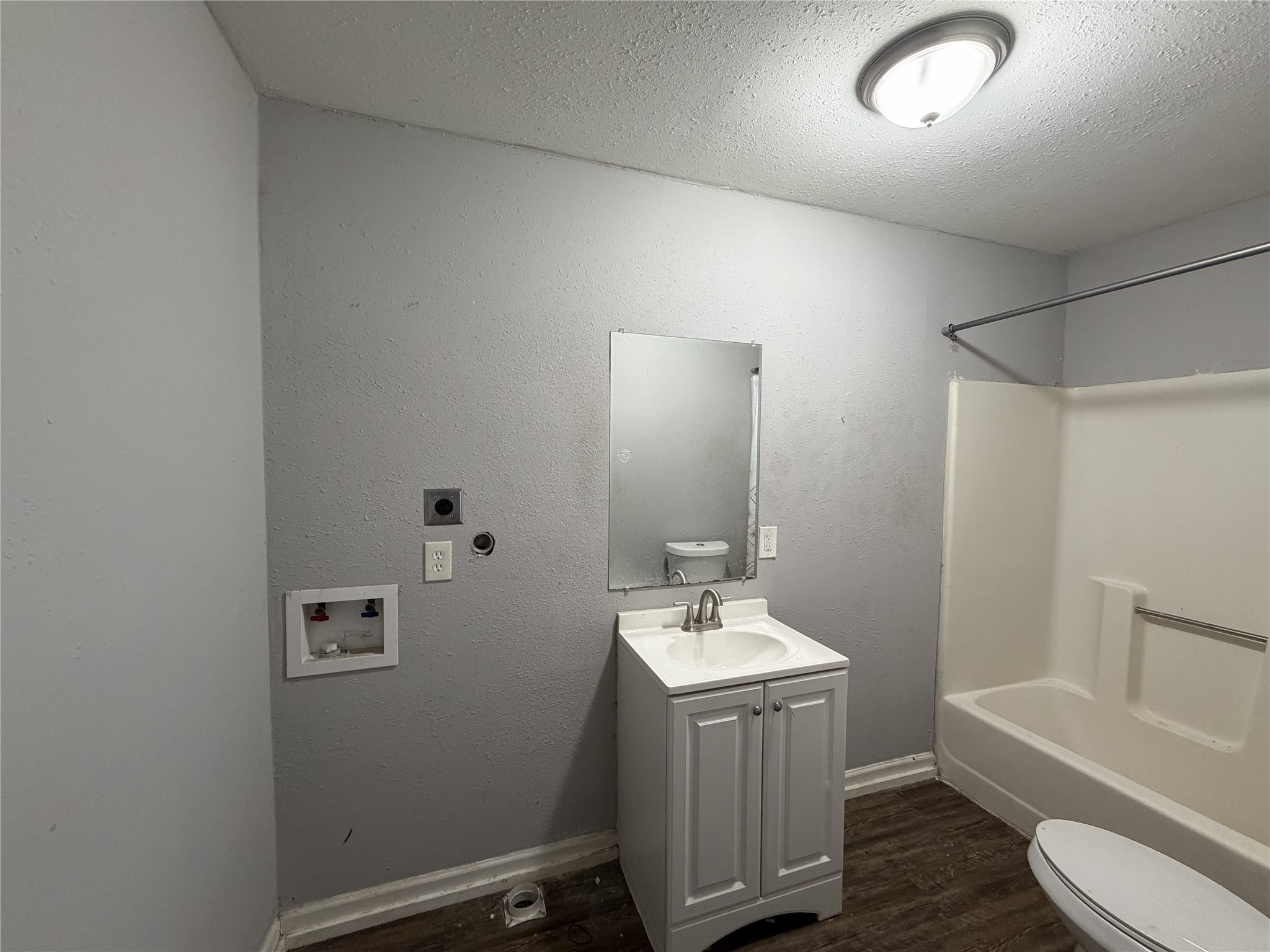 2409 Hodges Street Baytown, TX 77521 - Photo 18 of 29 a bathroom with a sink a toilet and bathtub