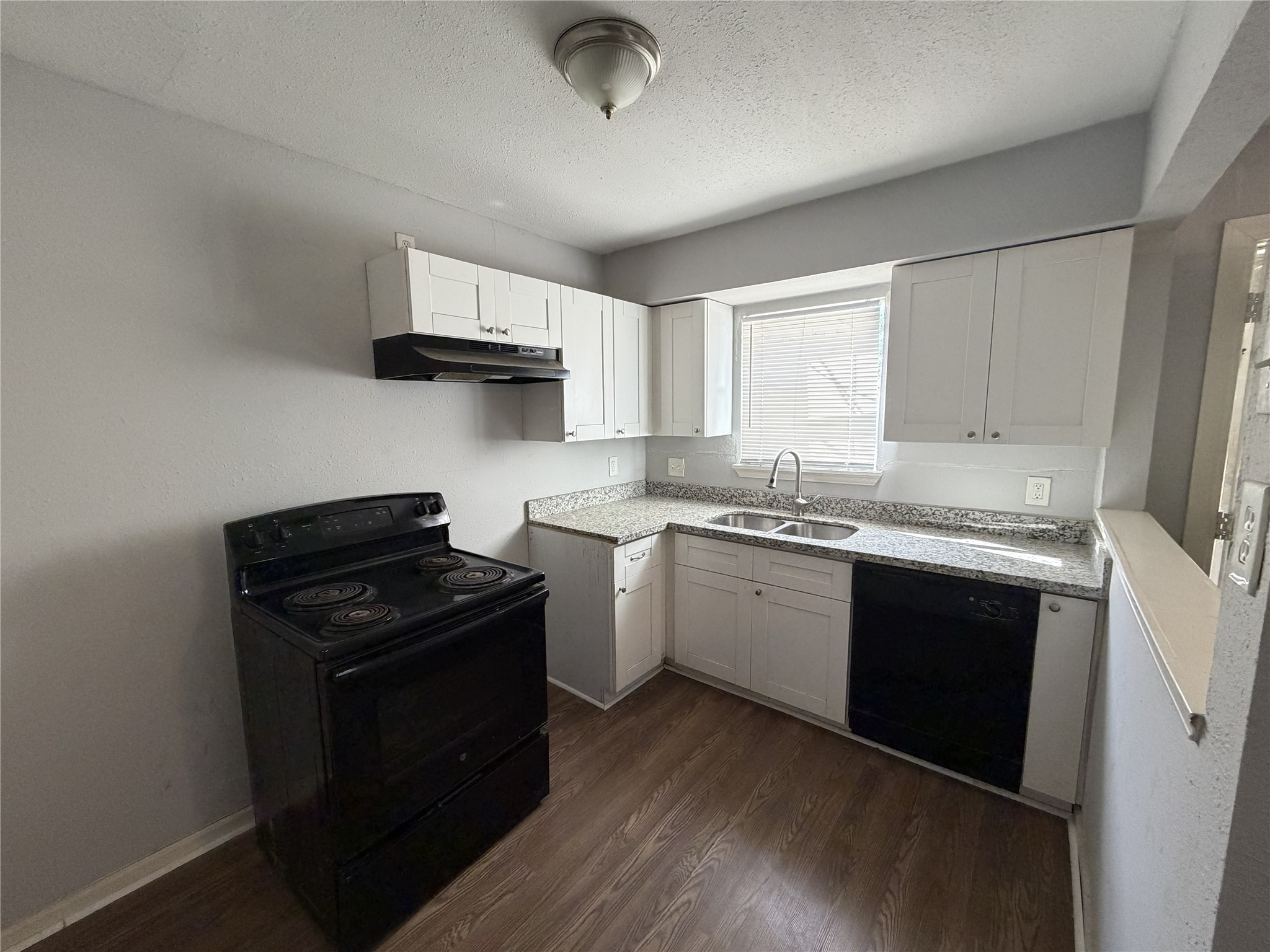 2409 Hodges Street Baytown, TX 77521 - Photo 2 of 29 a kitchen with a sink appliances and cabinets