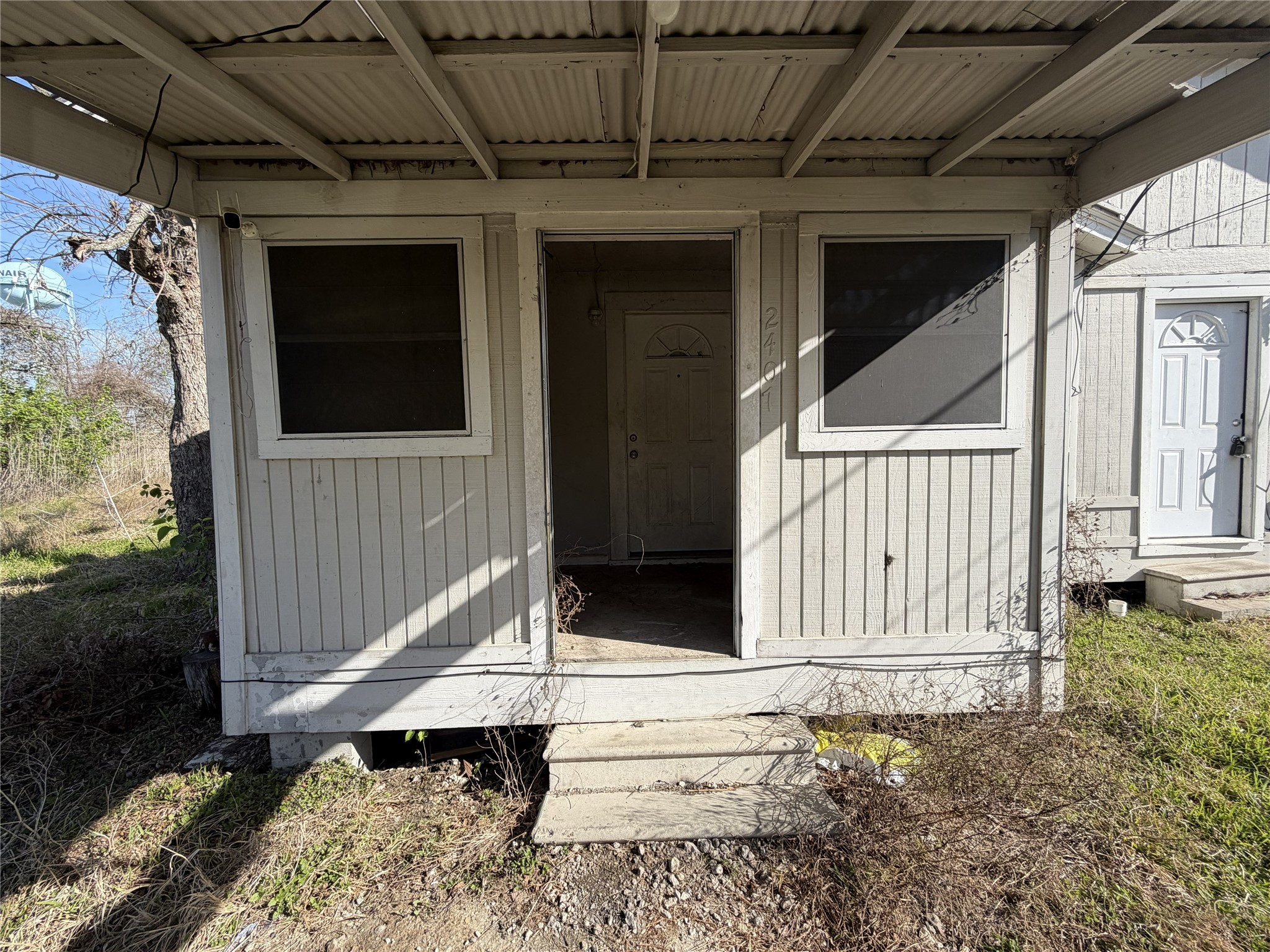 2409 Hodges Street Baytown, TX 77521 - Photo 22 of 29 a view of house with wooden floor and a fence