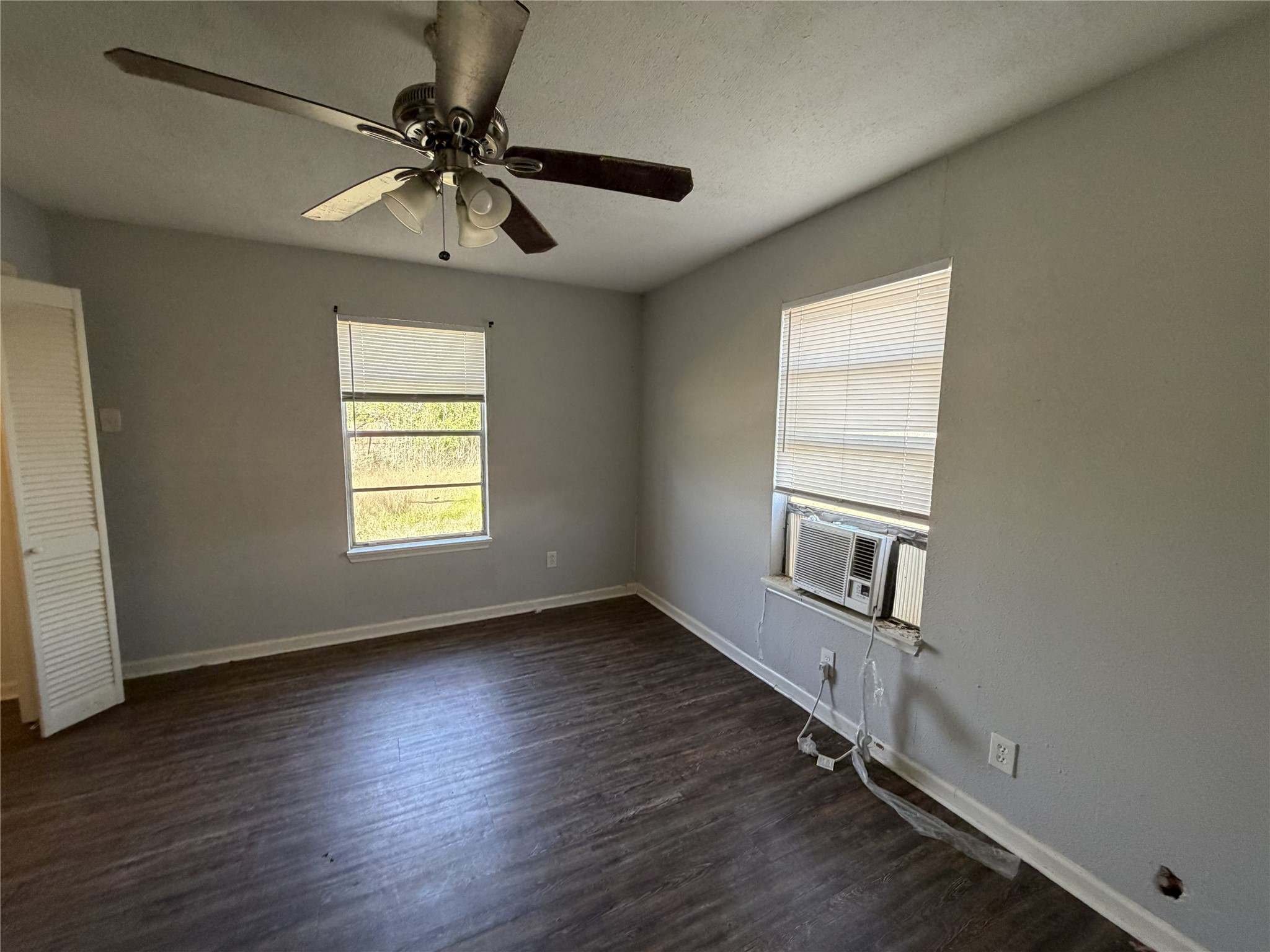2409 Hodges Street Baytown, TX 77521 - Photo 25 of 29 wooden floor in an empty room with a window