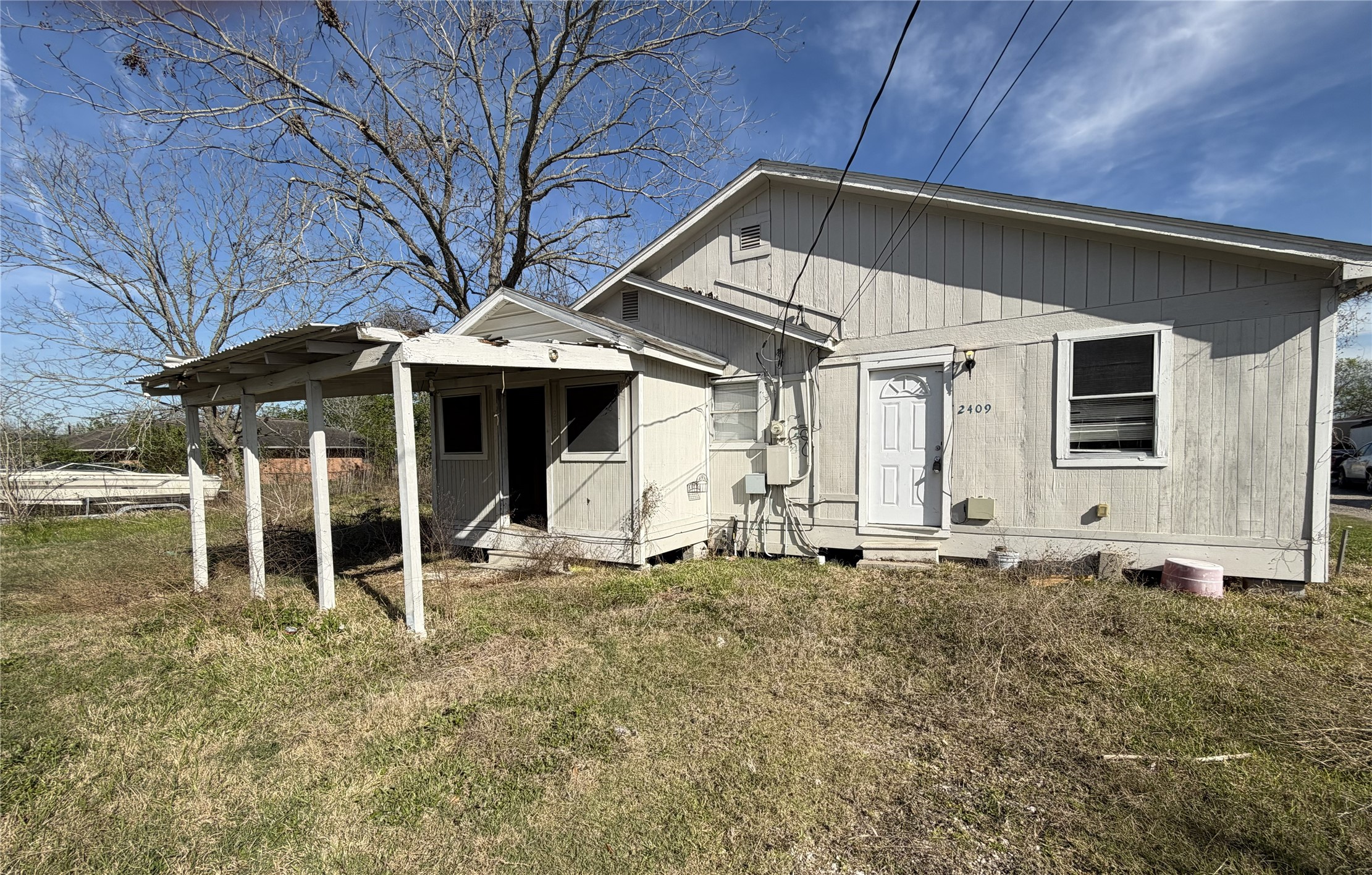 2409 Hodges Street Baytown, TX 77521 - Photo 26 of 29 a front view of a house with garden