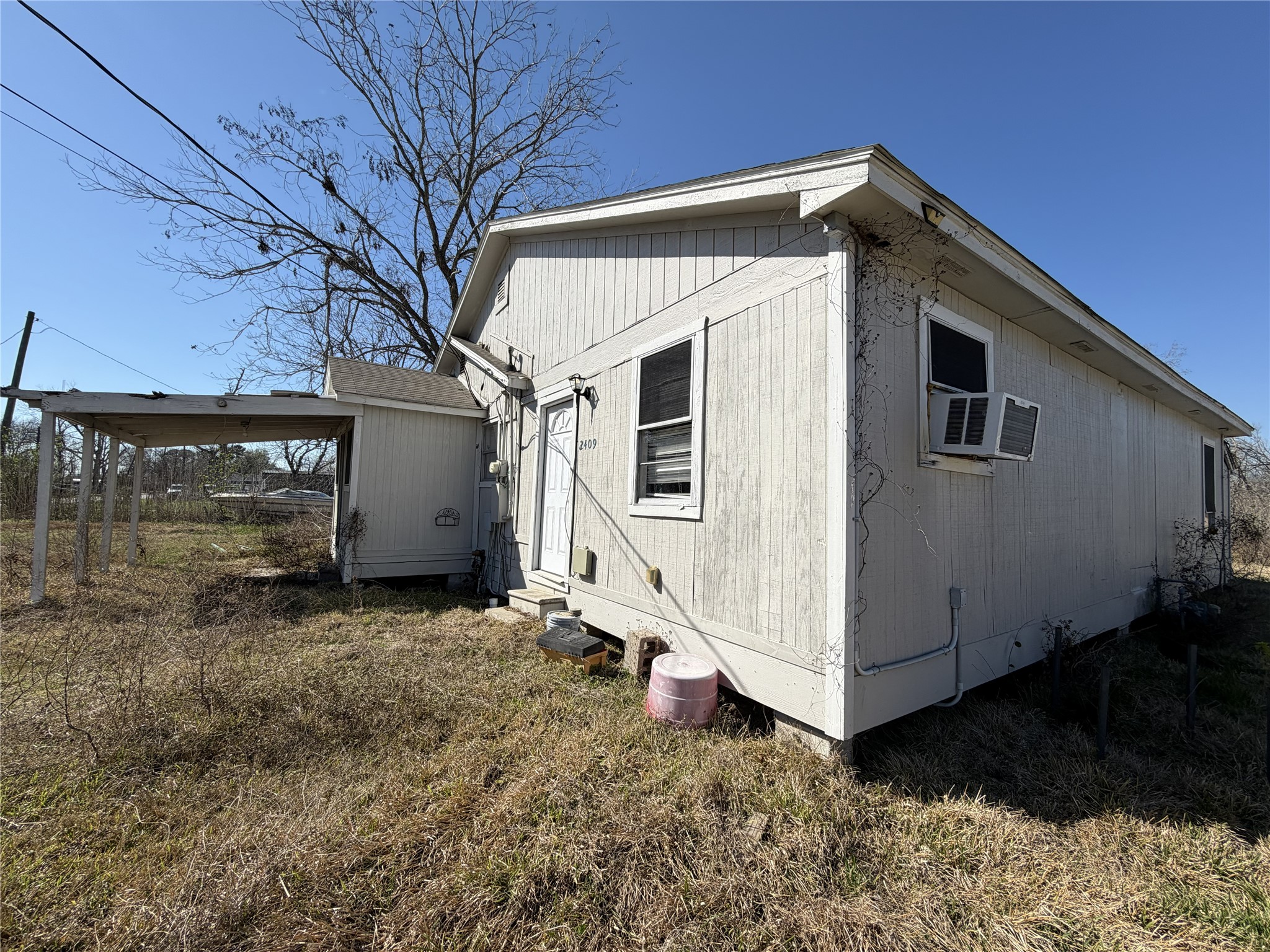 2409 Hodges Street Baytown, TX 77521 - Photo 29 of 29 a view of a house with a yard