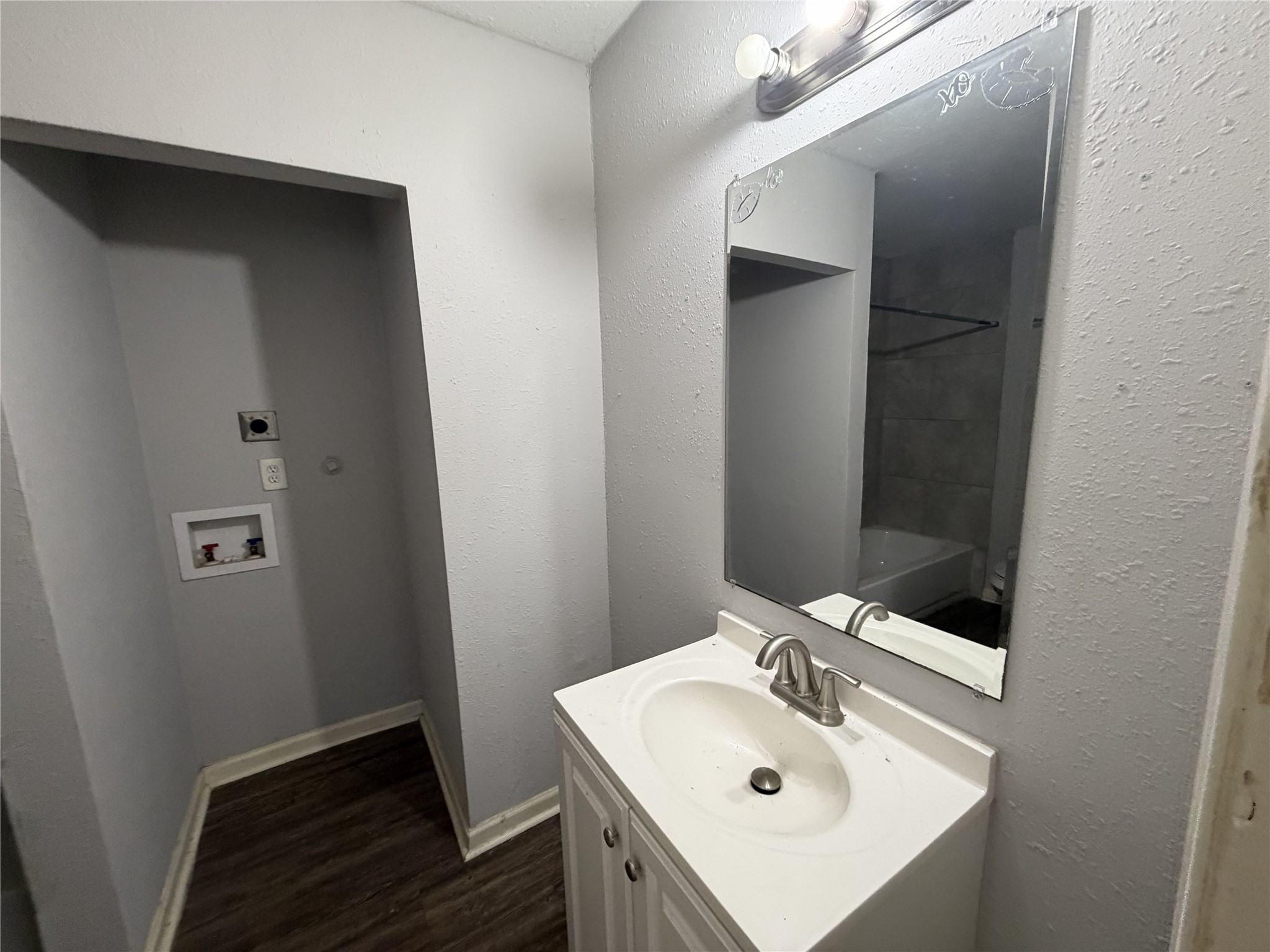 2409 Hodges Street Baytown, TX 77521 - Photo 10 of 29 a bathroom with a sink and a mirror