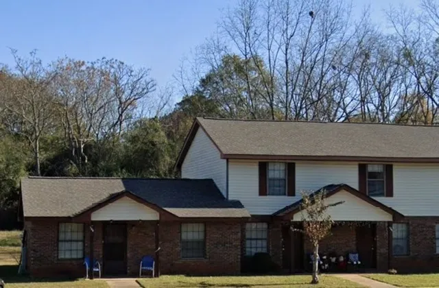 a front view of a house with a porch