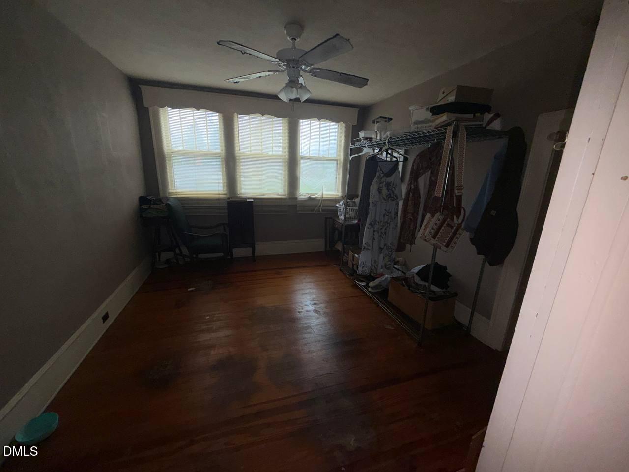414 Raleigh Road Oxford, NC 27565 - Photo 10 of 24 wooden floor in an empty room with a window