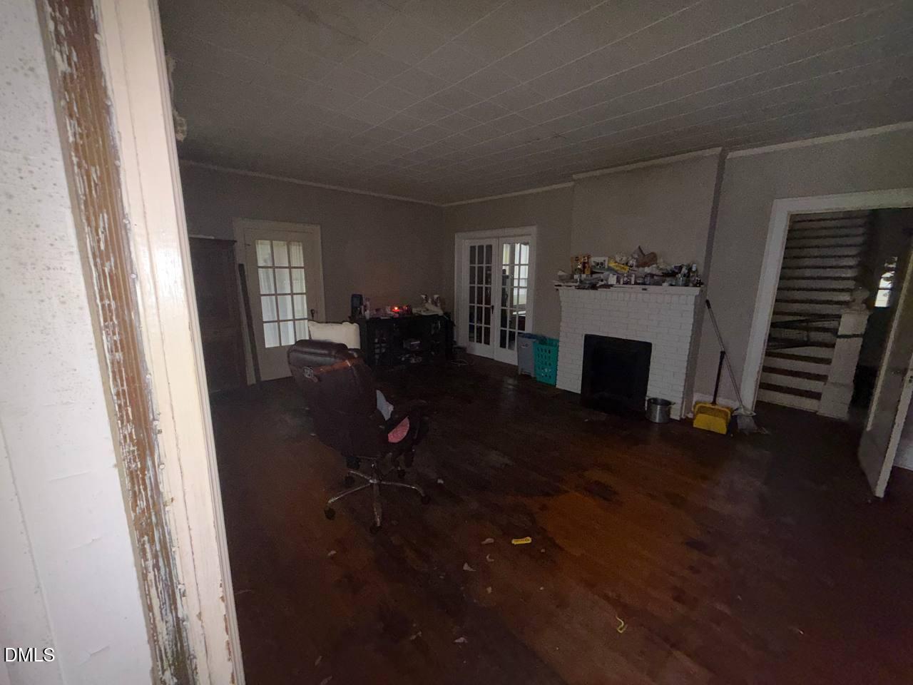 414 Raleigh Road Oxford, NC 27565 - Photo 11 of 24 a living room with furniture and a fireplace