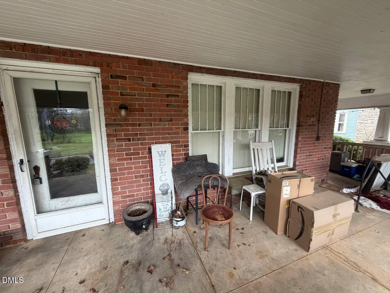 414 Raleigh Road Oxford, NC 27565 - Photo 13 of 24 a dining room with furniture and large windows