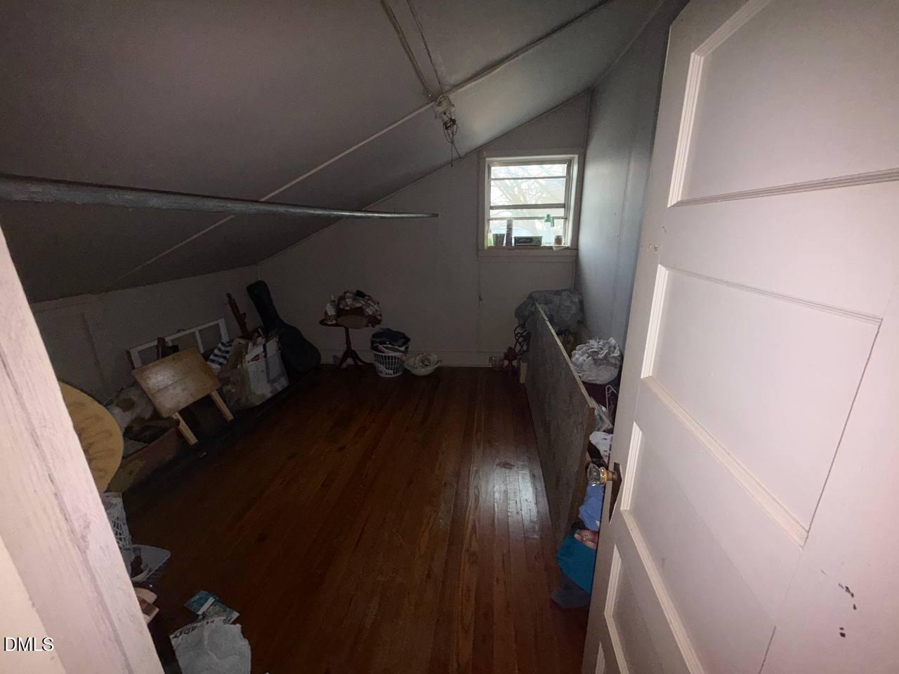 414 Raleigh Road Oxford, NC 27565 - Photo 15 of 24 a view of a hallway with wooden floor and stairs