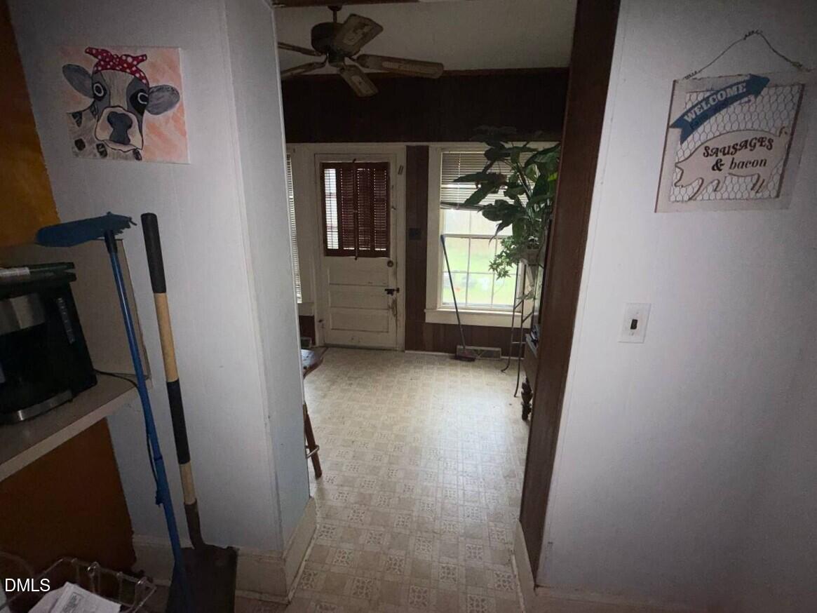 414 Raleigh Road Oxford, NC 27565 - Photo 19 of 24 a view of a hallway with workspace