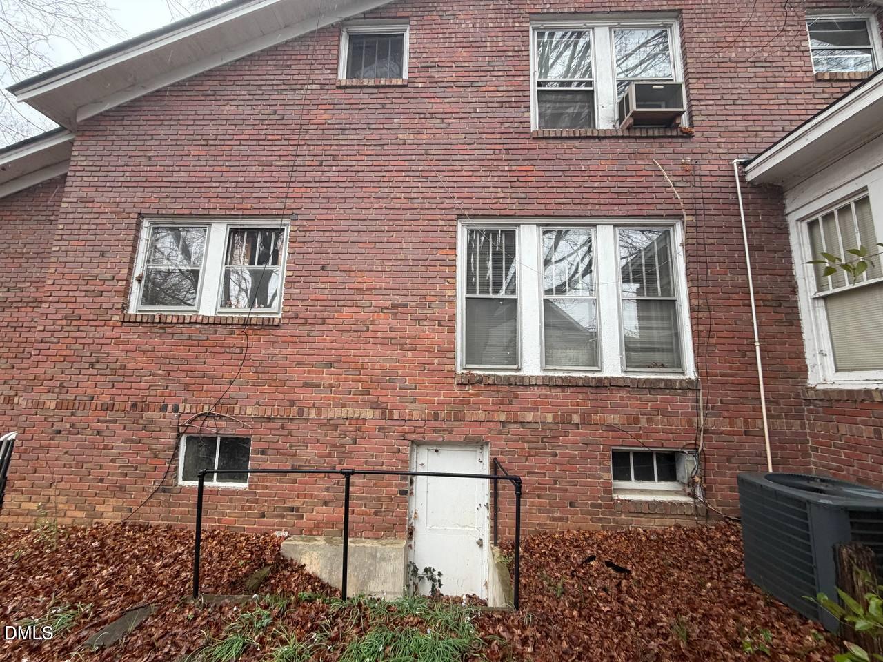414 Raleigh Road Oxford, NC 27565 - Photo 21 of 24 a front view of a house with a yard and outdoor seating