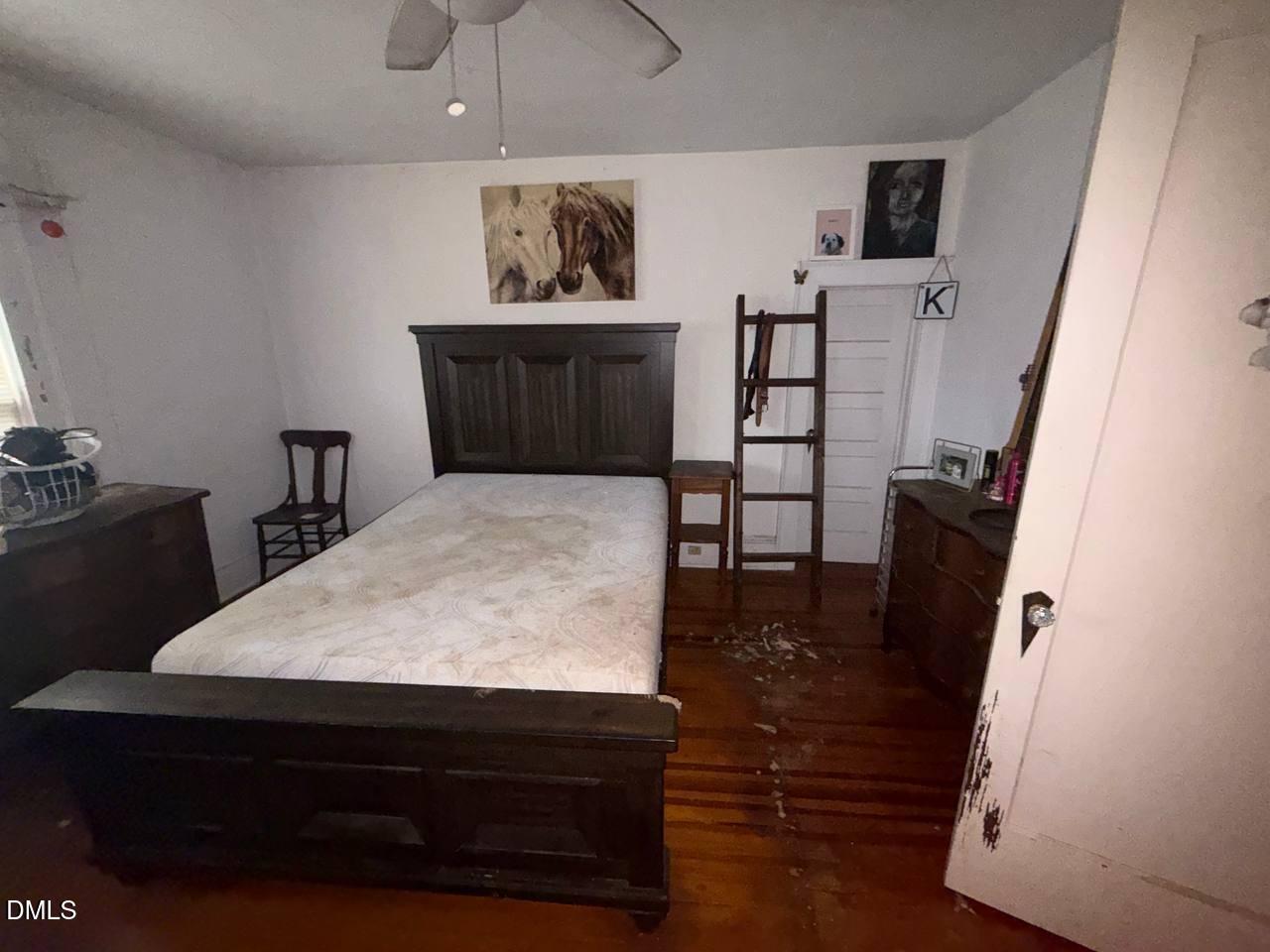 414 Raleigh Road Oxford, NC 27565 - Photo 5 of 24 a room with a table chairs and a refrigerator