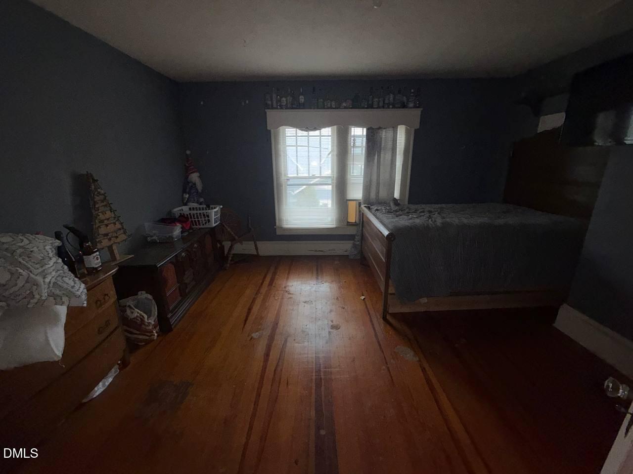 414 Raleigh Road Oxford, NC 27565 - Photo 9 of 24 a bed sitting in a room next to a window